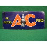 Enamel advertising sign for AC Plugs and Oil Filters featuring a large central spark plug