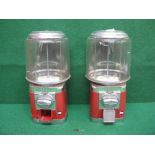 Pair of late 20th century bubble gum dispensers in red and silver,