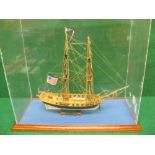 Detailed wooden model of a two masted armed American sailing ship Lexington contained in a wood and