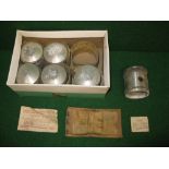 Six Hepolite pistons for a six cylinder Morris engine with packing paperwork labelled ENDH W 42