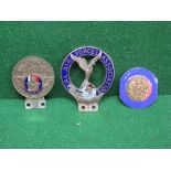Three car badges, one for the Royal Air Forces Association,
