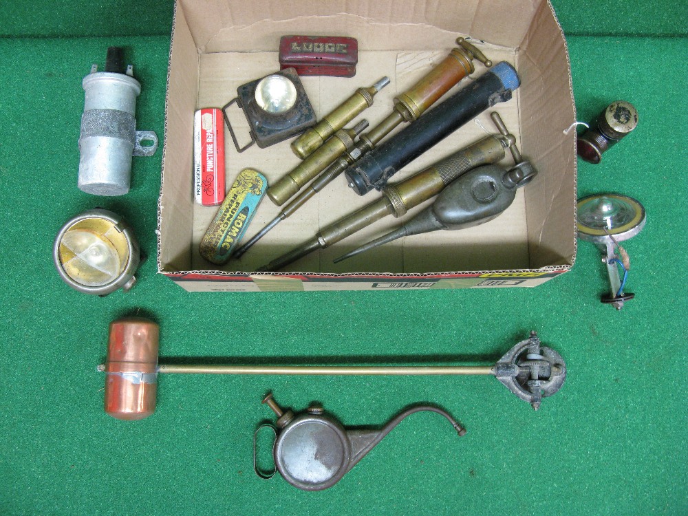 Box containing oil cans, small lamps,