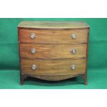 Mahogany bow fronted chest of drawers having three long graduated drawers with brass hoop handles