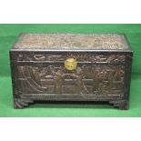 Painted camphor wood chest carved with Oriental figures and scenery,