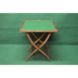 Walnut folding coaching table opening to reveal a green baized surface,