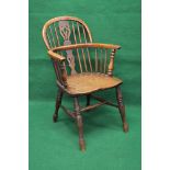 Yew wood Windsor chair having pierced back splats and spindles leading to elm seat,