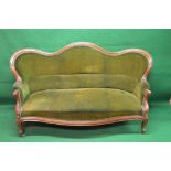 Mahogany show wood framed hump back settee having scrolled arms and shaped seat front,