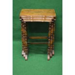 Nest of three walnut occasional tables having shaped tops with moulded edges,