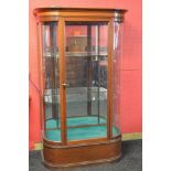 Victorian mahogany rounded corner display case having moulded cornice over central glazed door
