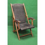 Hardwood folding campaign chair having upholstered back, seat and arm pads,