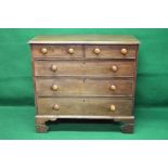 Mahogany chest of five drawers having turned knob handles,