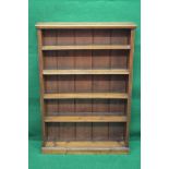 Victorian pine bookcase having moulded top over four adjustable shelves supported on reeded sides