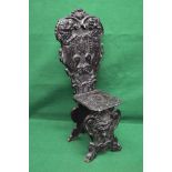 Heavily carved oak hall chair having pierced back with carved decoration of two lions flanking