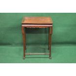 Oriental hardwood occasional table having rectangular top over a shaped frieze,