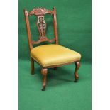 Walnut framed nursing chair having carved top rail and pierced and carved back splat supported on