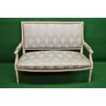 Louis XVI style painted frame settee having carved frame with padded back and arms over a bow