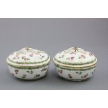 Pair of Sevres Style Lidded Oval Bowls decorated with pink roses, each lid with intertwined handles