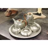Liberty's & Co Tudric Hammered Pewter Tea Service comprising Circular Tray, Tea Pot, Coffee Pot,