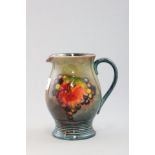 Moorcroft Pottery Jug, fruit and berries pattern, signed W Moorcroft to base