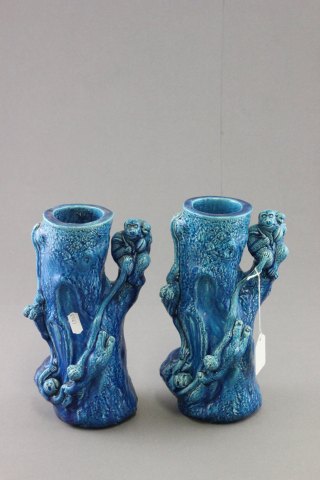 Two matching blue Majolica stone glazed vases in the form of Monkeys in trees