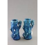 Two matching blue Majolica stone glazed vases in the form of Monkeys in trees