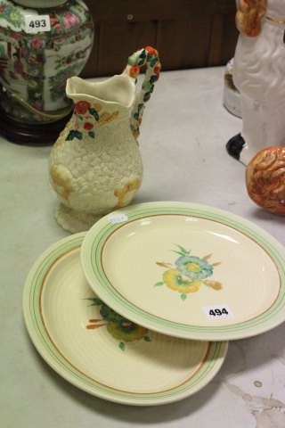 Three items of Clarice Cliff including jug and two plates