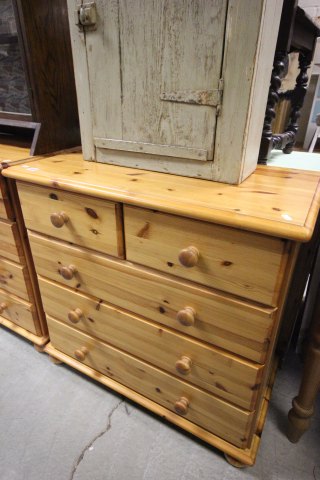 Contemporary pine chest of two over three drawers