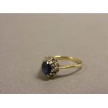 9ct Gold Ring with a Sapphire and Diamonds (some diamonds missing)