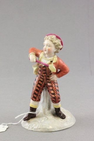 Meissen figure of a child with Racket Cross Sword mark to base impressed no. 70