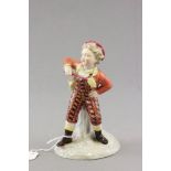 Meissen figure of a child with Racket Cross Sword mark to base impressed no. 70