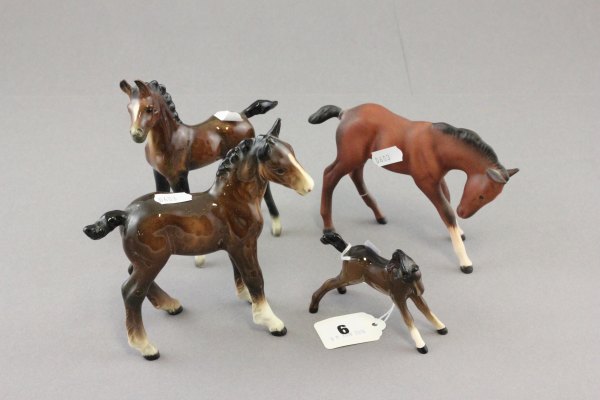 Two Beswick brown foals (one af) plus two other brown foals