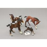 Two Beswick brown foals (one af) plus two other brown foals