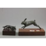 Two Peter Hicks figures featuring a hare and a fox