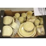 Poole 'Compact' style (yellow oatmeal) including eight tea plates, eight cups, 21 saucers, two