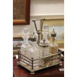 Silver Plated and Glass Six Bottle Condiment Set together with a Silver Plated Breakfast Toast and