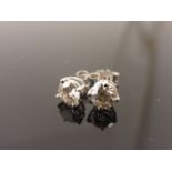 Pair of 14ct w/g diamond ear studs 1ct exact weight