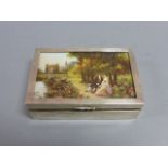 Silver cased cigarette box with decorated lid showing lovers in a rural setting