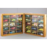 Two Glazed Display Cabinets each containing 15 Diecast Vehicles