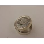 Silver pill box with embossed Masonic detail