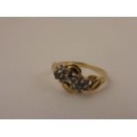 14ct Gold Ring with Two Flowers set with Small Diamonds and Sapphire