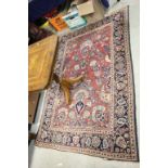 Red ground rug with all over flowers & medallions