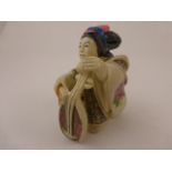 Oriental figure of a lady playing harp