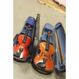 Two Cased Violins with Three Bows