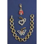 Swarovski Gold Plate Charm Bracelet with Three Charms ( Butterfly, Ladybird and Entwined Hearts ) in
