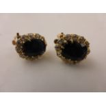 Pair of y/gold clip on sapphire and diamond cluster earrings