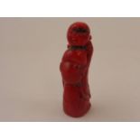 An unusual Chinese carved coral figure