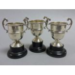 Three Silver Trophies on Stands, hallmarked Chester dated 1935, 1937 and 1938