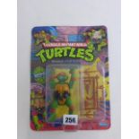 Original carded Playmates Teenage Mutant Ninja Turtles Raphael figure early '10 Back' run, un-