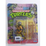 Original carded Playmates Teenage Mutant Ninja Turtles Donatello figure early '10 Back' run, un-