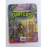 Original carded Playmates Teenage Mutant Ninja Turtles Donatello figure early '10 Back' run, un-